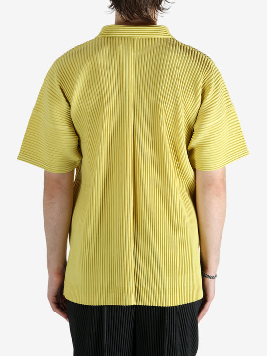 Yellow shirt worn by a person, showing the shirt's fit