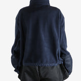 Navy jacket worn by a person, showing the jacket's fit