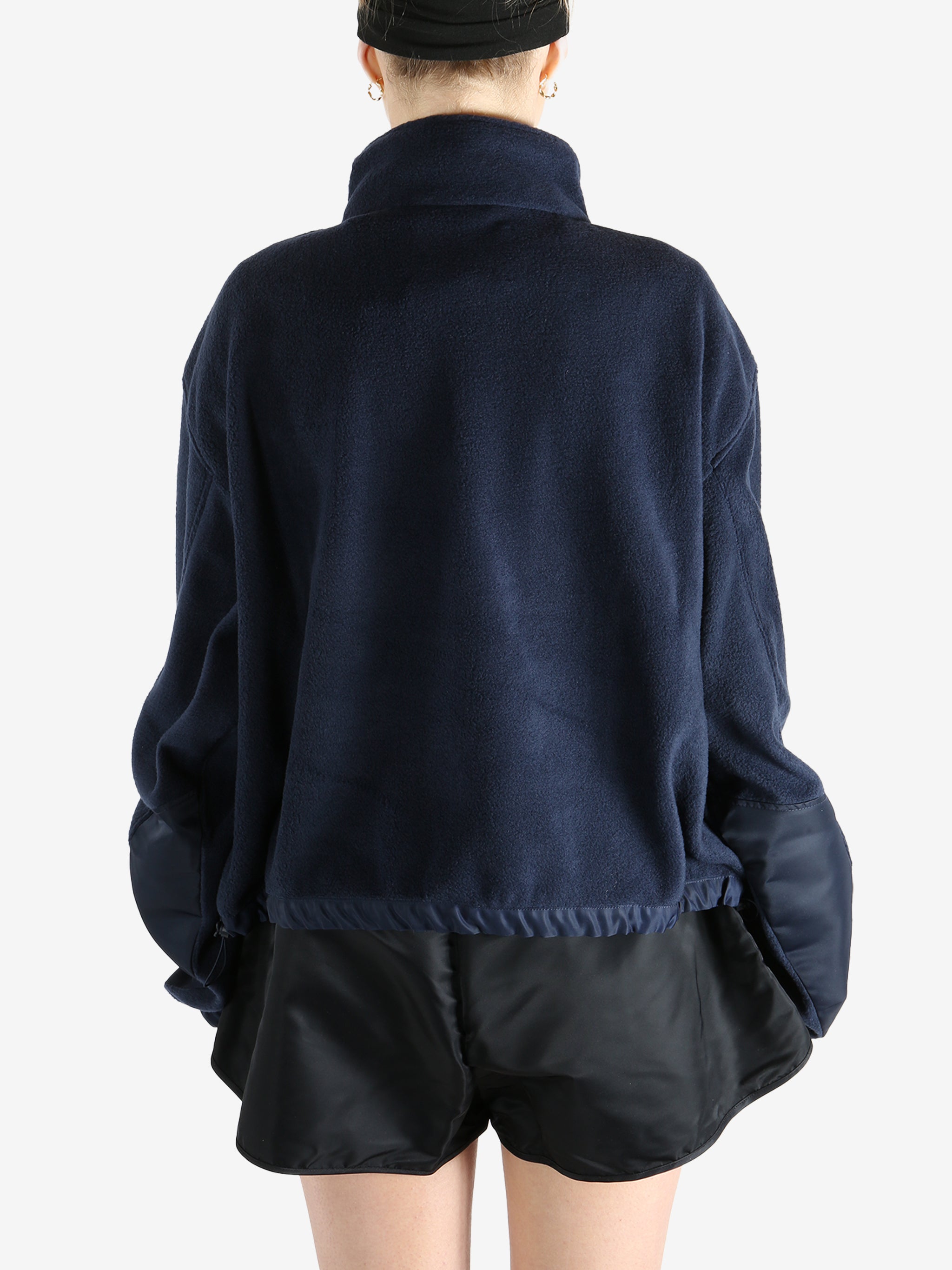 Navy jacket worn by a person, showing the jacket's fit