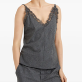 Grey tops worn by a person, showing the tops fit