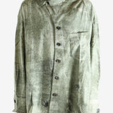 Green shirt worn by a person, showing the shirt's fit