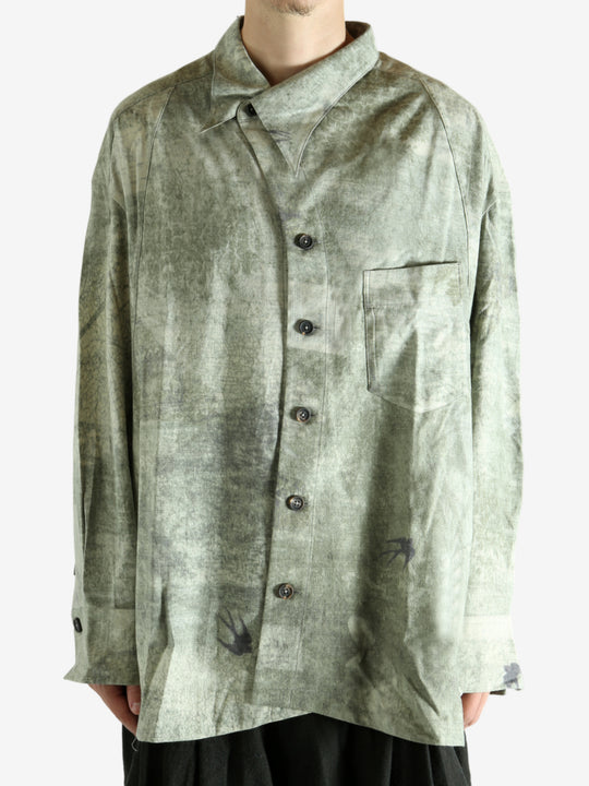 Green shirt worn by a person, showing the shirt's fit