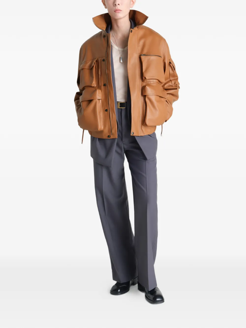 Brown jacket worn by a person, showing the jacket's fit