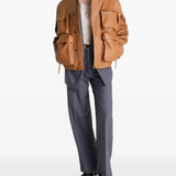 Brown jacket worn by a person, showing the jacket's fit
