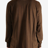 Brown shirt worn by a person, showing the shirt's fit