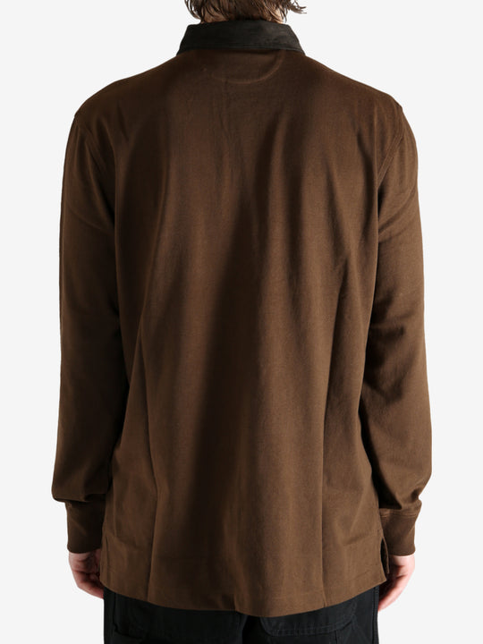 Brown shirt worn by a person, showing the shirt's fit