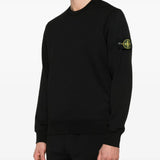 Black sweatshirt worn by a person, showing the sweatshirt fit