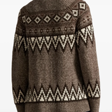 Brown knitwear worn by a person, showing the knitwear's fit