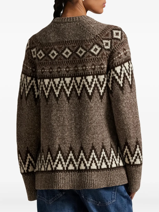 Brown knitwear worn by a person, showing the knitwear's fit