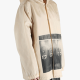 Tan jacket worn by a person, showing the jacket's fit