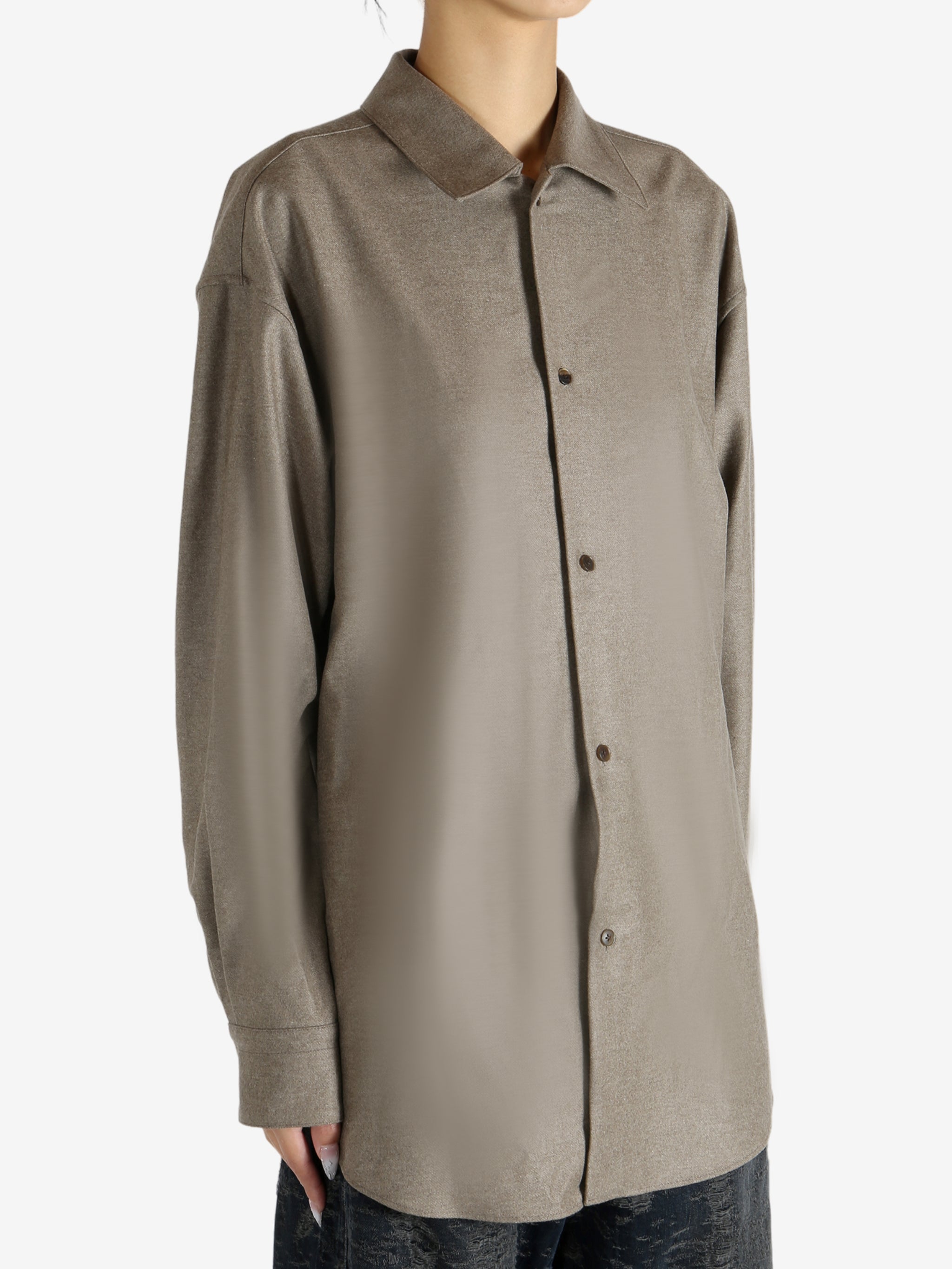 Brown shirt worn by a person, showing the shirt's fit