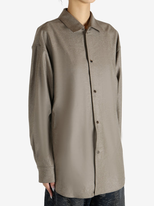 Brown shirt worn by a person, showing the shirt's fit