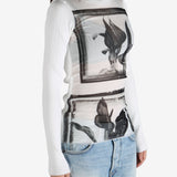 White top worn by a person, showing the top's  fit