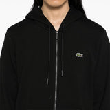 Close up of black hoodies, showing texture of the cotton fabric