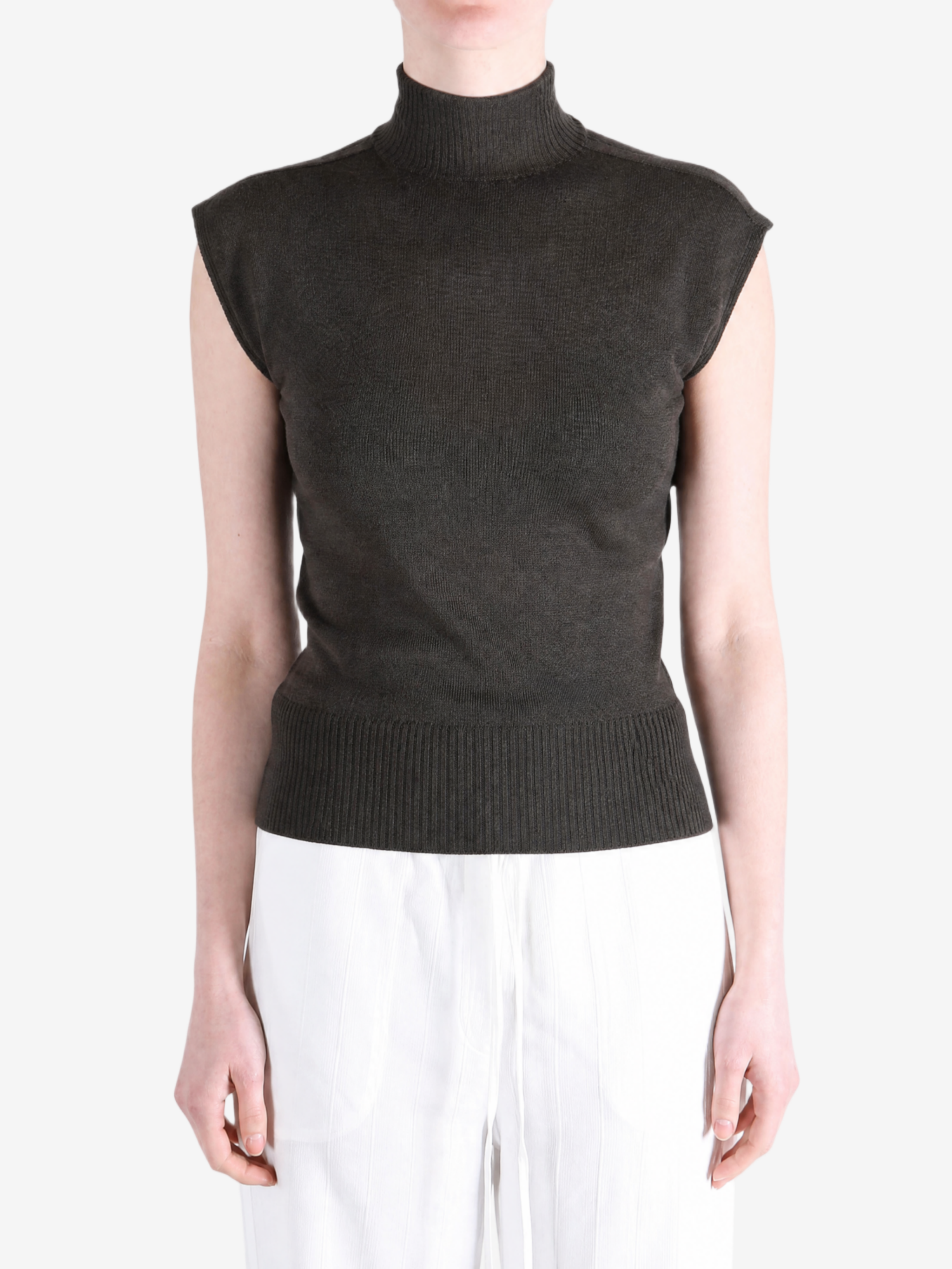 Brown top worn by a person, showing the top fit