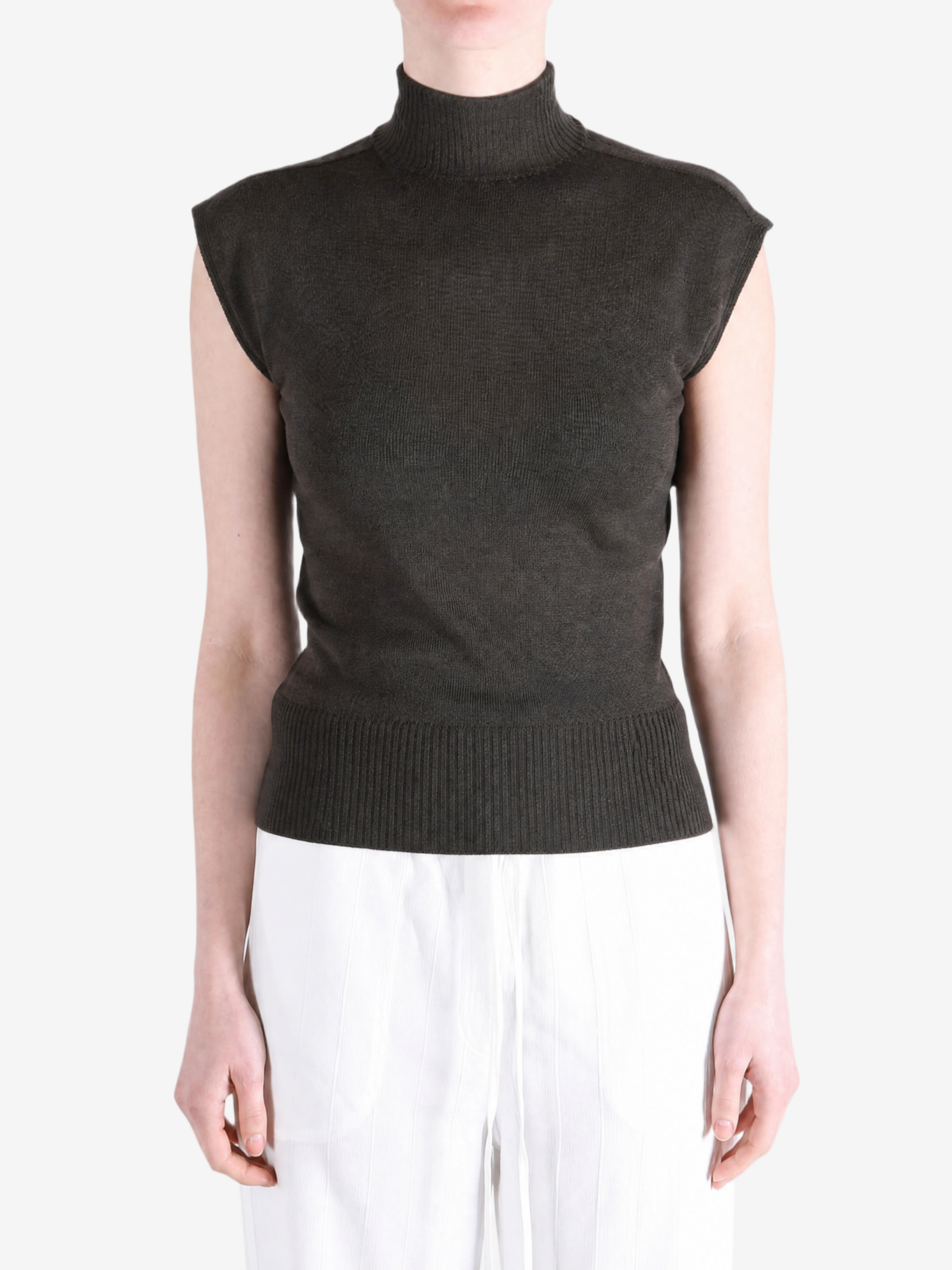 Brown top worn by a person, showing the top fit