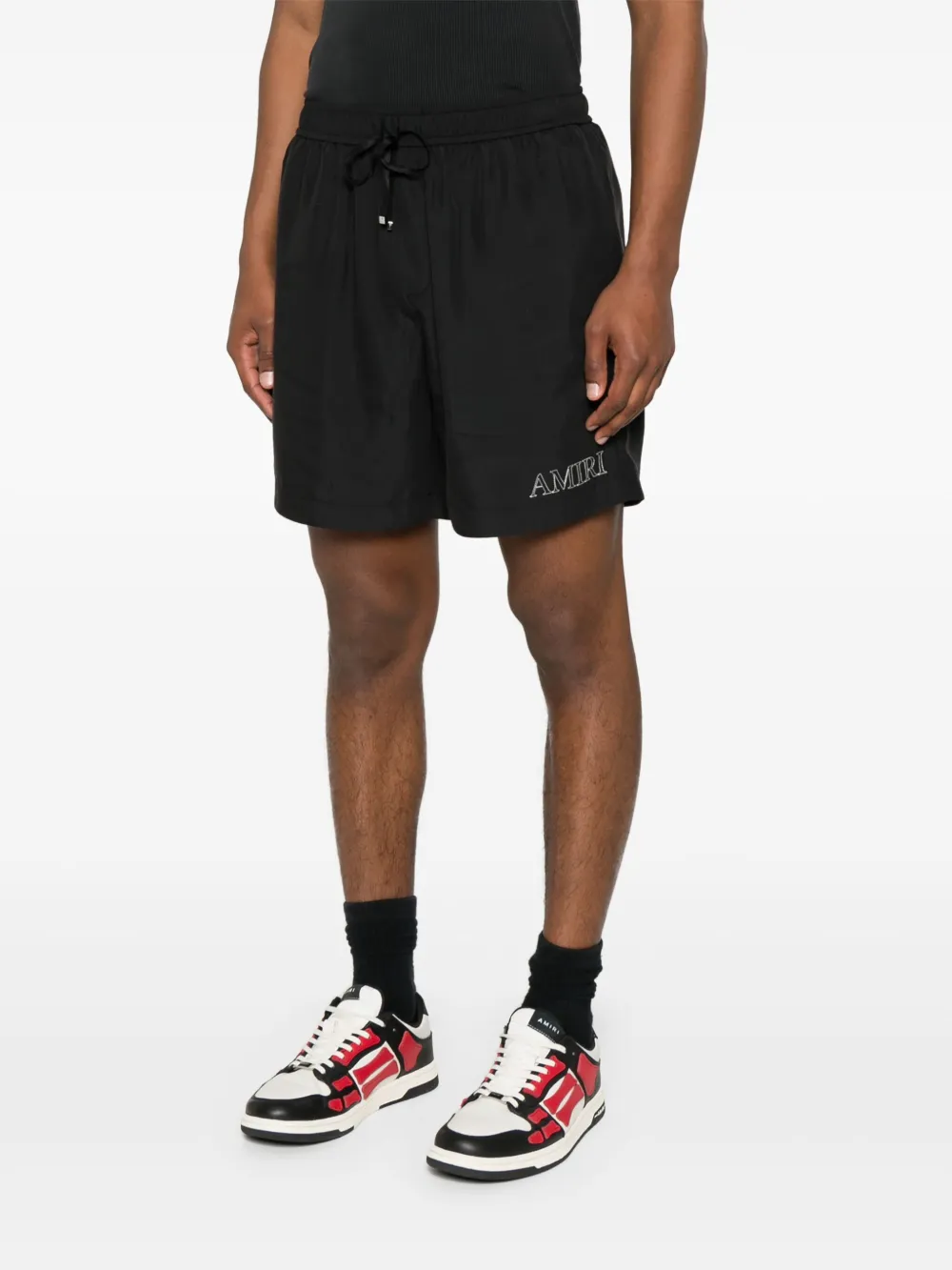 Black shorts worn by a person, showing the shorts's fit