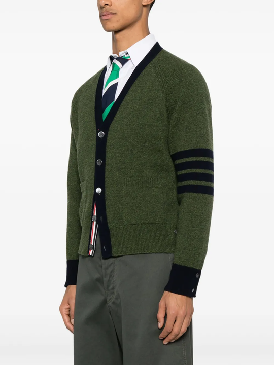 green knitwear worn by a person, showing the knitwear fit