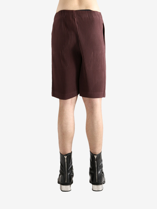 Brown shorts worn by a person, showing the short's fit