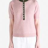 Pink shirt worn by a person, showing the shirt fit
