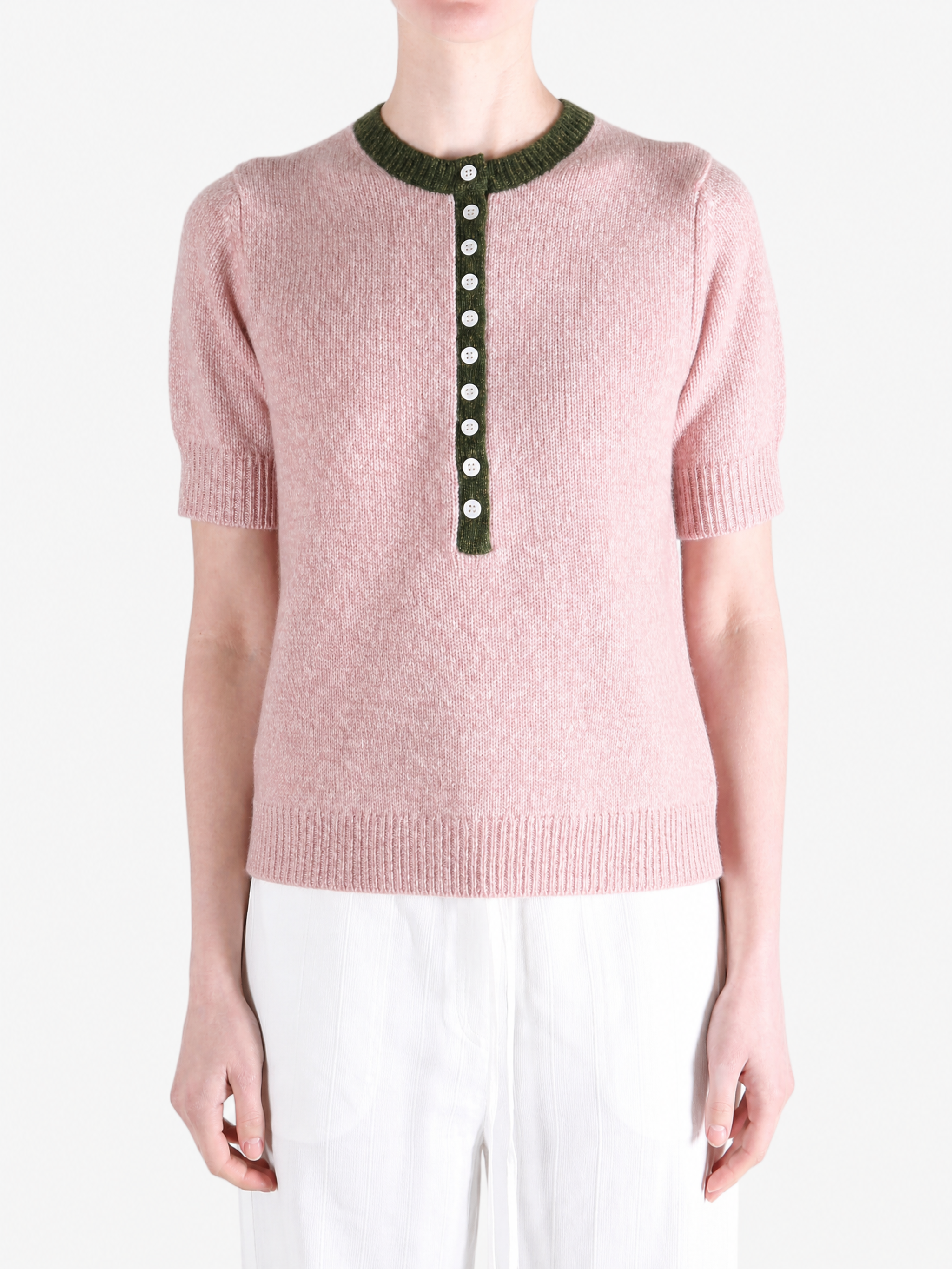 Pink shirt worn by a person, showing the shirt fit
