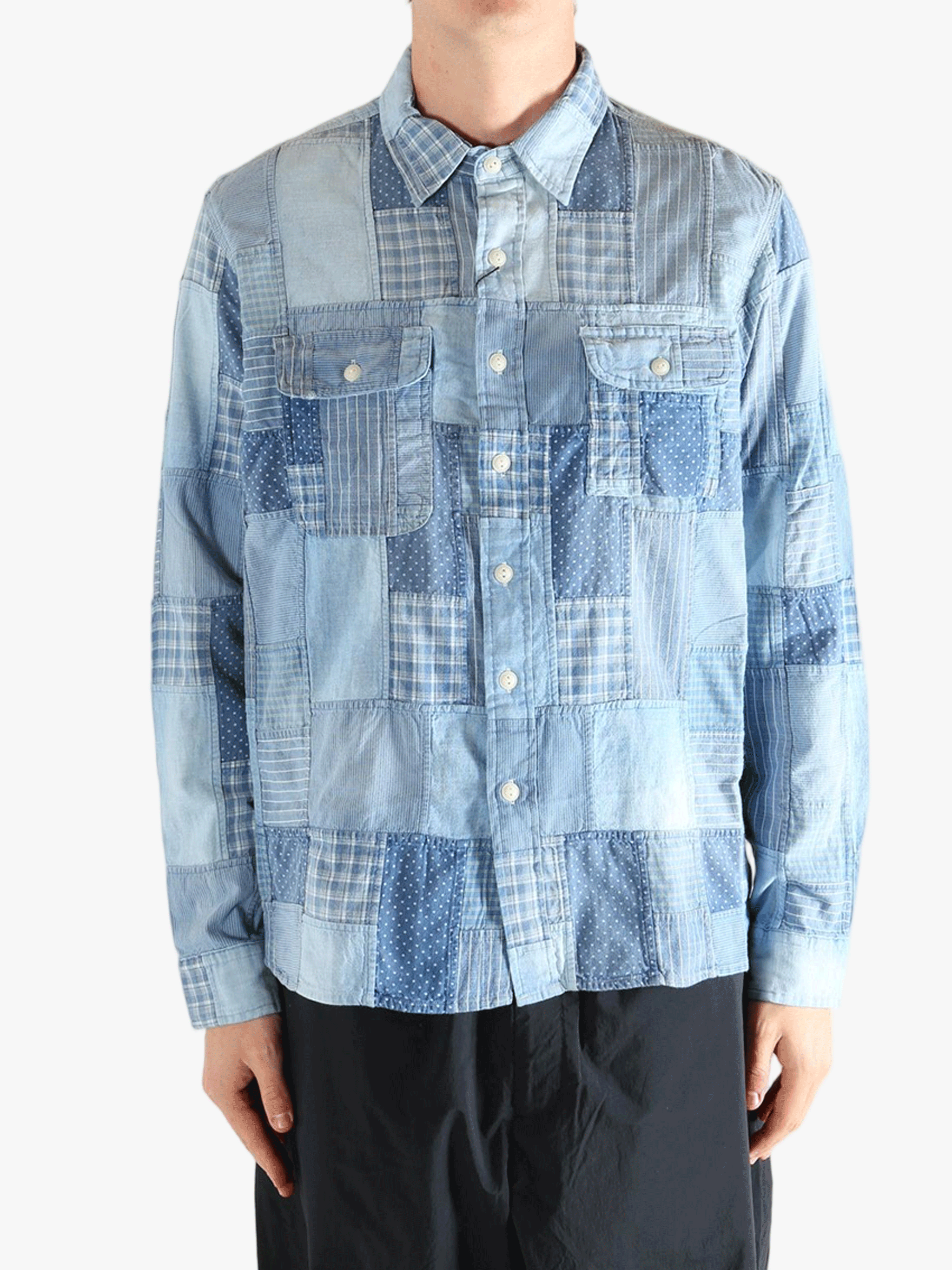 Blue shirt worn by a person, showing the shirt's fit