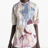 Tan shirt worn by a person, showing the shirt  fit