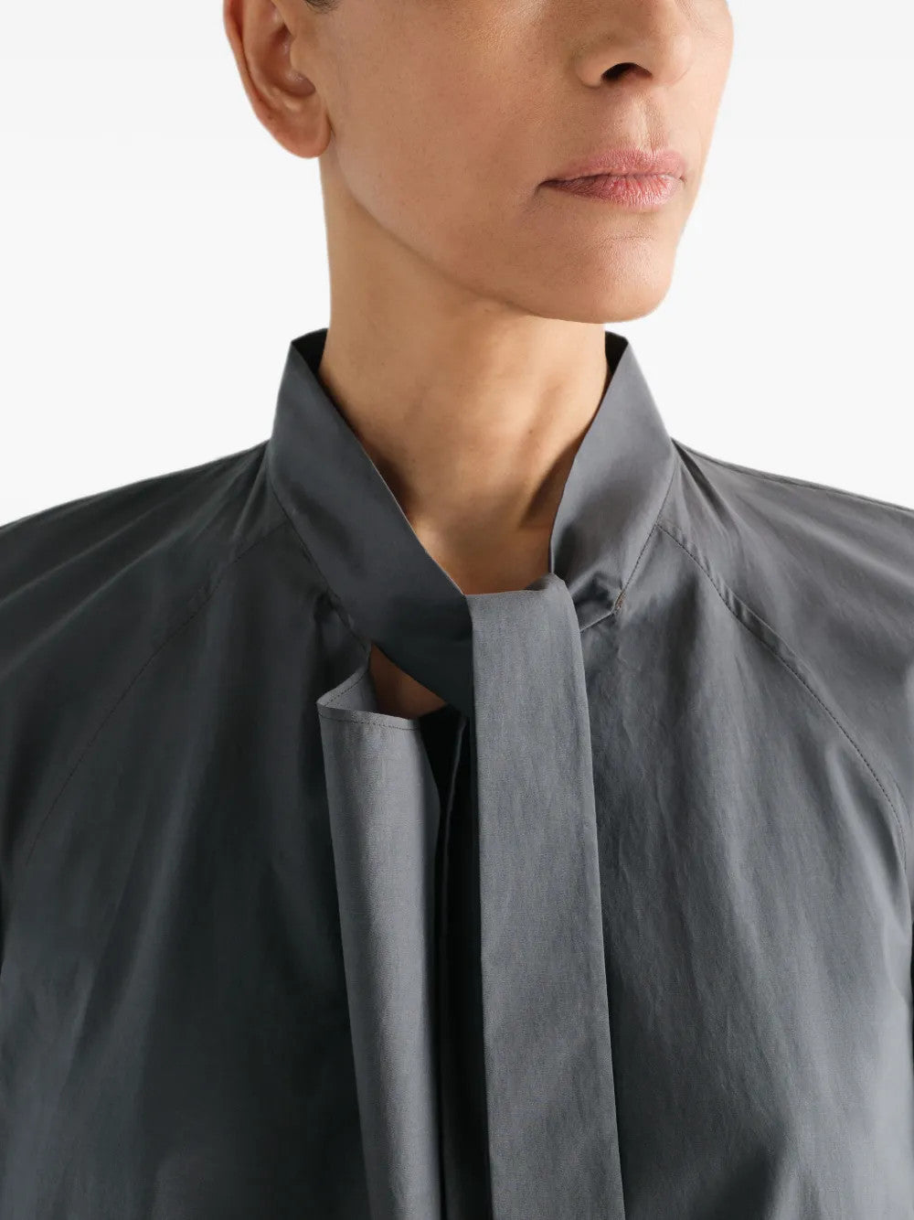 Grey dress worn by a person, showing the dress fit