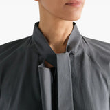 Grey dress worn by a person, showing the dress fit