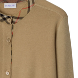 Close up of tan cardigan,showing texture of the wool fabric