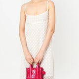 Pink bag carried by a person, showing the bag's fit