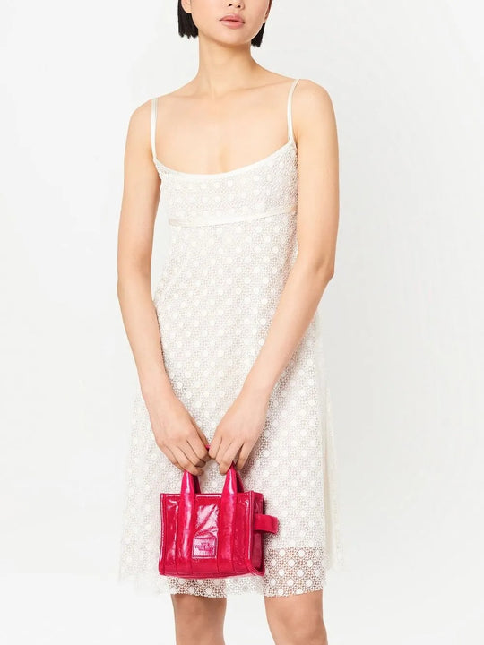 Pink bag carried by a person, showing the bag's fit