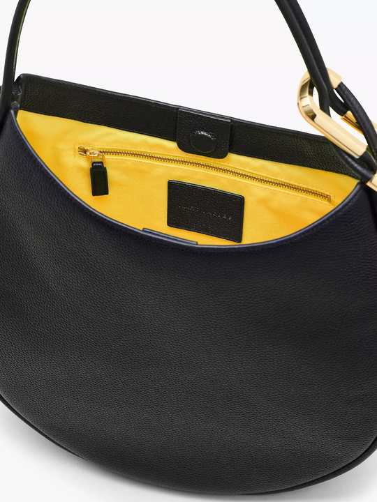 Close up of black bag, showing texture of the leather fabric