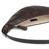 Close up of the brown bag, showing texture of the leather fabric