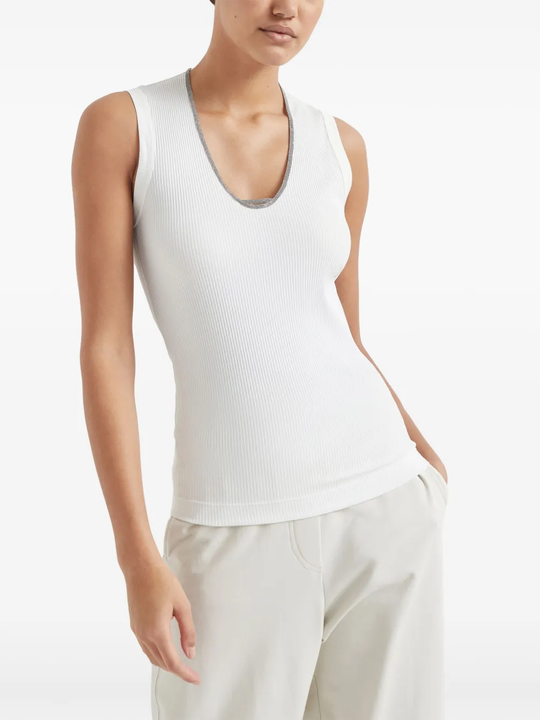 White tops worn by a person, showing the tops fit