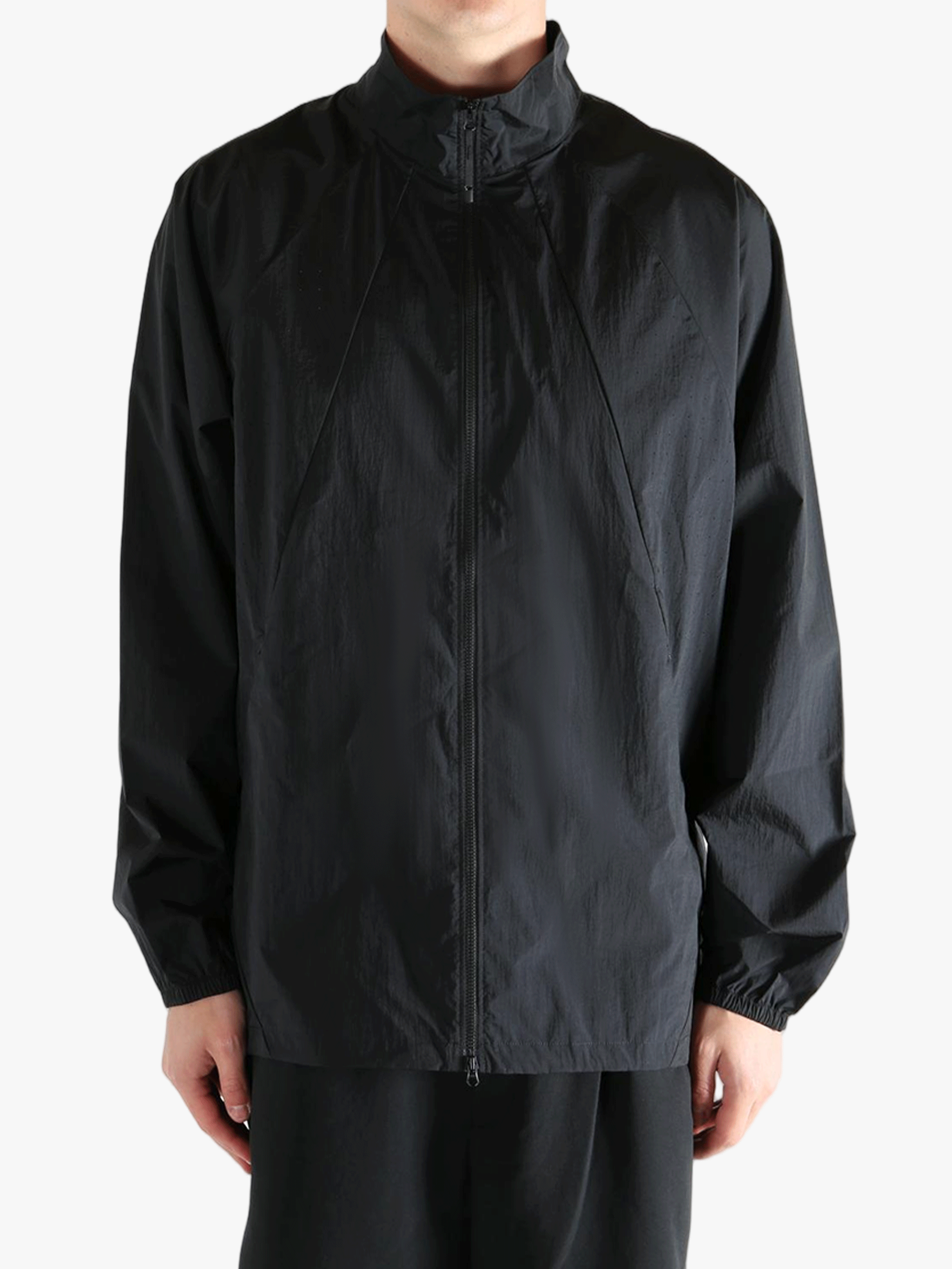 Black jacket worn by a person, showing the jacket's fit