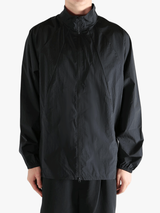 Black jacket worn by a person, showing the jacket's fit