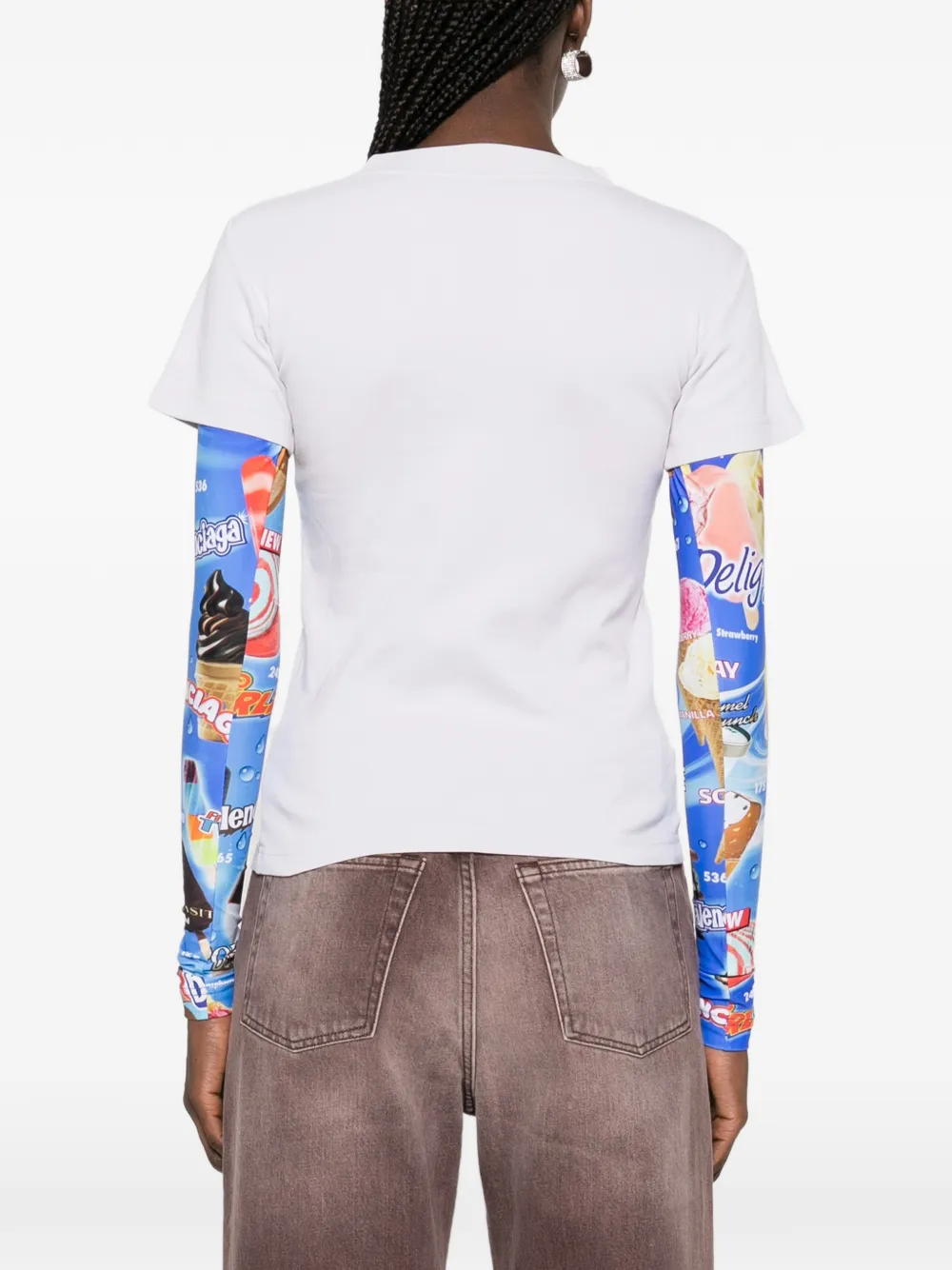 white t-shirt worn by a person, showing the t-shirt fit