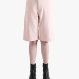 Pink shorts worn by a person, showing the shorts's fit