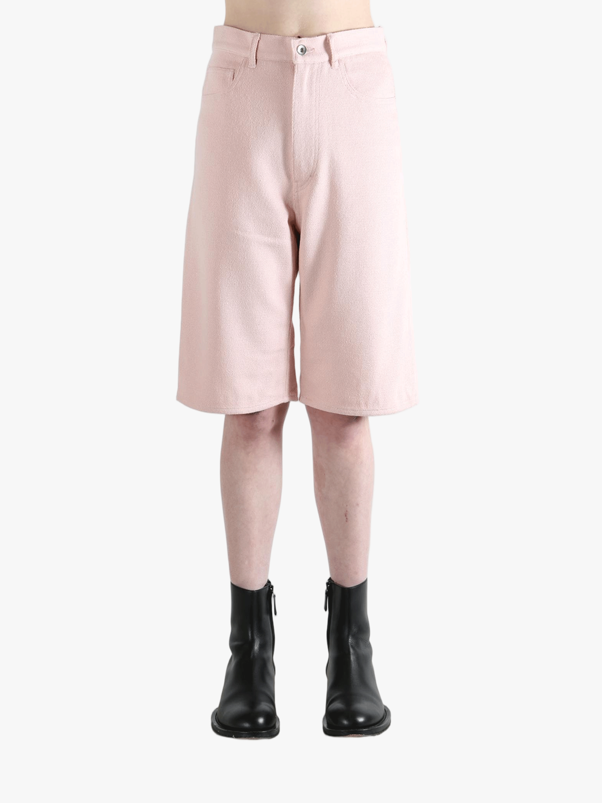 Pink shorts worn by a person, showing the shorts's fit