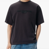 Black shirt worn by a person, showing the shirt fit