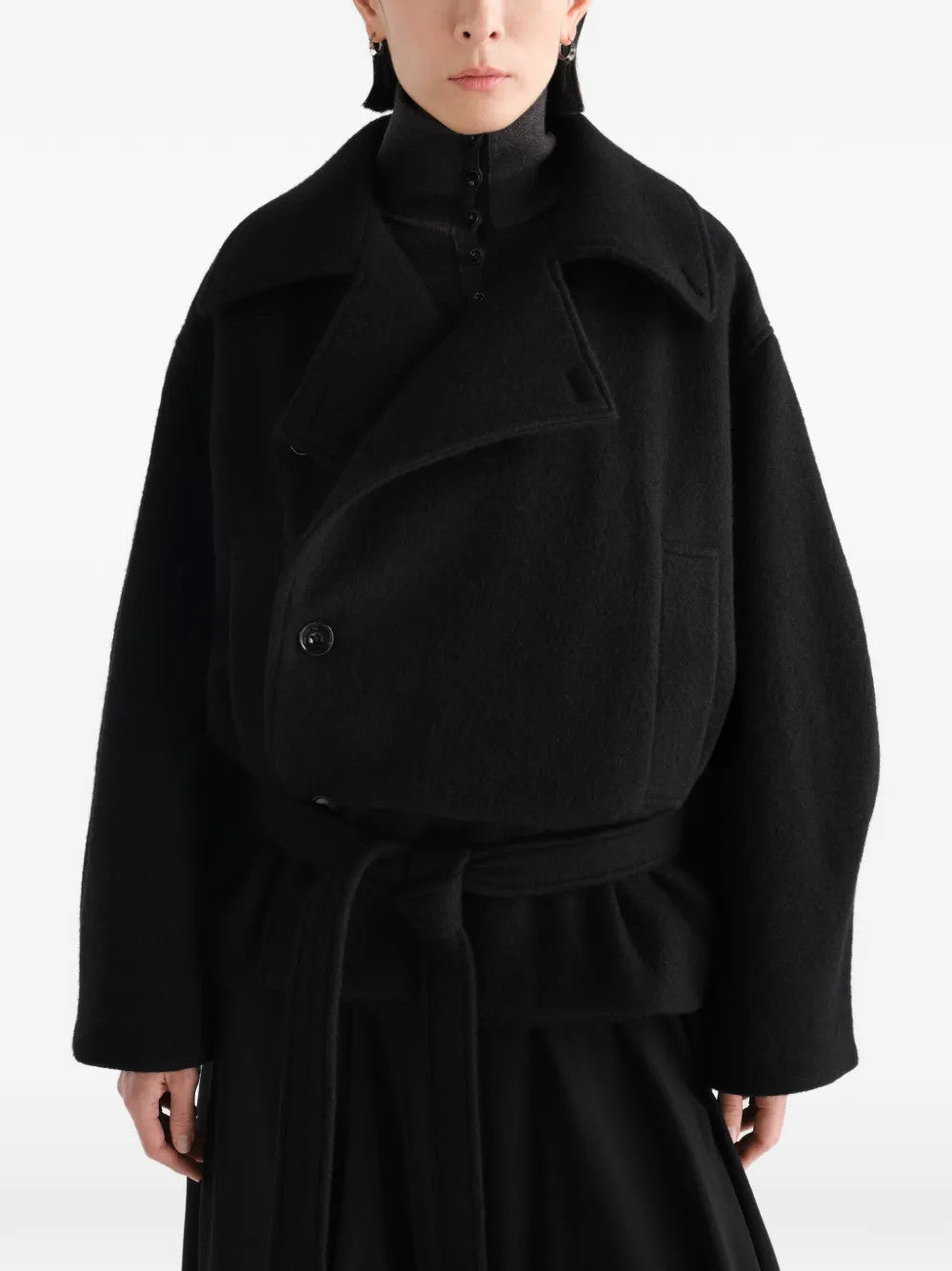 Black jacket worn by a person, showing the jacket fit