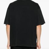 Black t-shirt worn by a person, showing the shirt's fit