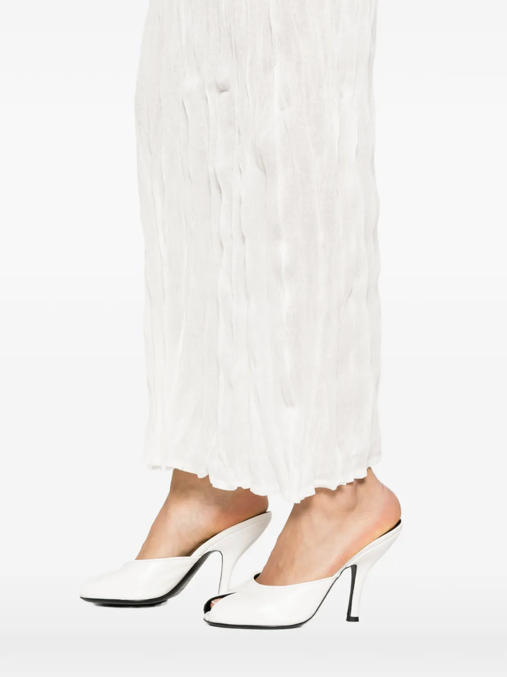 Close up of white skirts, showing texture of the crinkled
