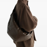Brown bag worn by a person, showing the bag fit