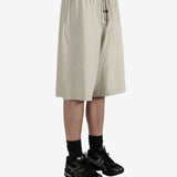 Grey shorts worn by a person, showing the shorts fit