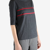 Grey t-shirts worn by a person, showing the t-shirts fit