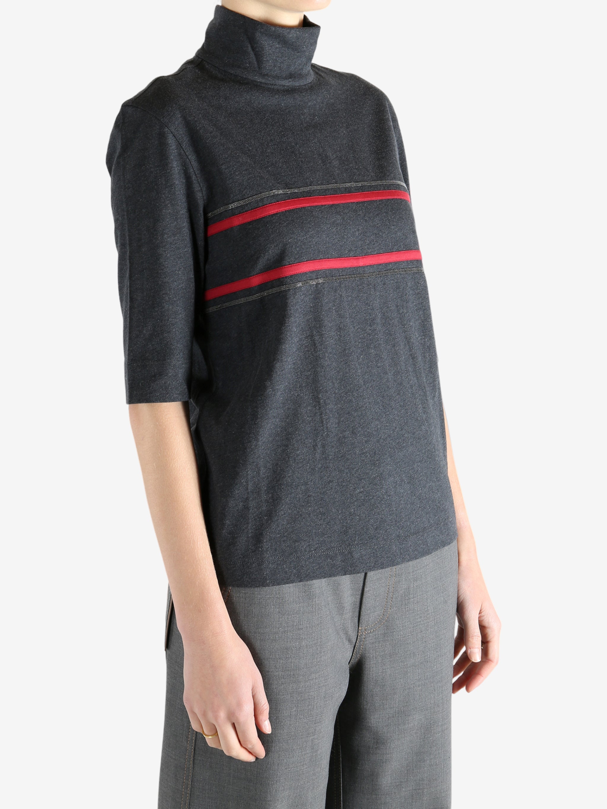 Grey t-shirts worn by a person, showing the t-shirts fit