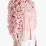 Pink blouse worn by a person, showing the blouse fit