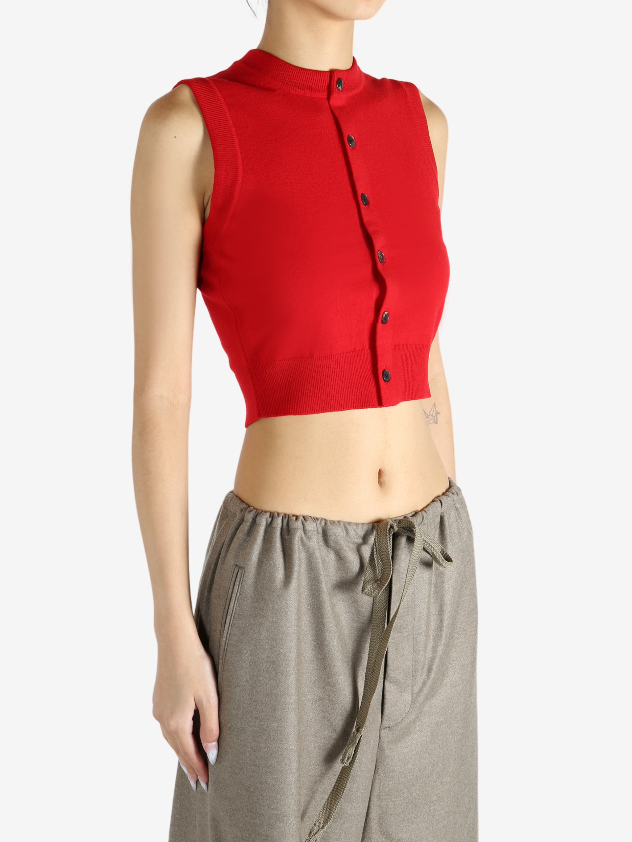 Red top worn by a person, showing the top's fit